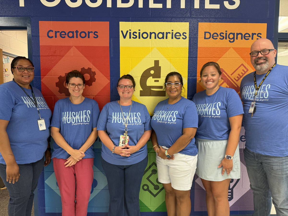 5th grade team standing together smiling.
